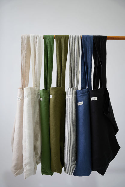 Natural linen tote bags, oversized, multiple colors, Lúa Miami logo detail, white studio background — Lúa Miami